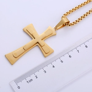 Detail view of large 18k gold triple-layered cross pendant showing 6.5cm size measurement