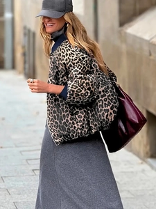 Detail showing the leopard print pattern and quilted texture on this reversible jacket