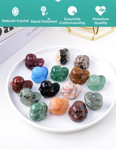 Detailed overhead view of assorted natural crystal duck figurines on a white ceramic plate