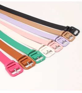 Close-up of minimalist women belts in 8 vibrant candy colors with matching square buckles