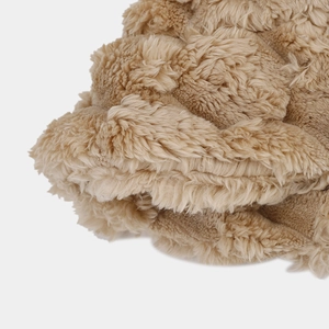 Macro view showing the thick, soft texture of the camel faux rabbit fur bucket hat