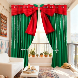 Close-up of green velvet holiday curtains with large red bows and white polka dot patterns