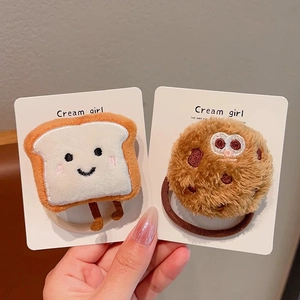 Close-up of cute plush toast and cookie cartoon hair ties set for women and girls