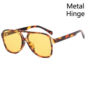 Retro aviator sunglasses with yellow lenses, tortoise frames and sturdy metal hinges