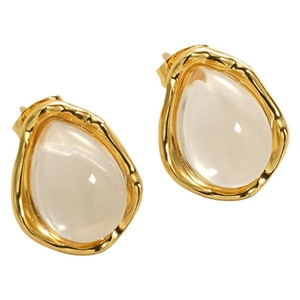Irregular geometric resin stud earrings with textured gold metal frame on white background