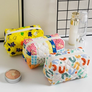 Portable quilted floral cotton cosmetic storage bags in three stylish colorful patterns