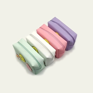 Portable makeup bags in four colors with chenille smiley face patches and zipper closure
