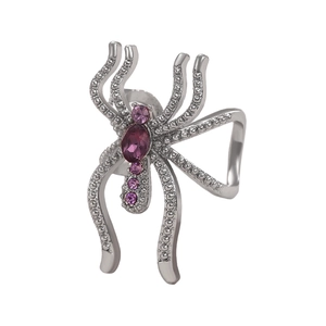 Bague araignée argentée avec strass violets sur fond blanc pour la mode d'Halloween