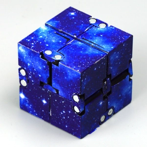Detailed close-up of the infinity cube toy featuring a blue starry sky pattern and hinges
