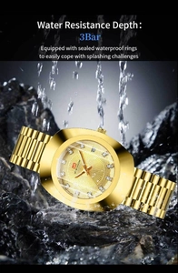 Close-up of gold quartz watch with diamond markers on wet rocks showing 3Bar water resistance