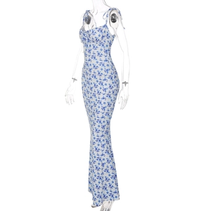 Detailed view of summer dress with blue floral pattern on a professional ghost mannequin
