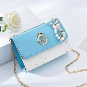 Blue and white chain crossbody bag with star details and pearl tassel on a white pedestal