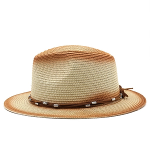 Detail of gradient woven straw hat with braided rope band and engraved silver beads