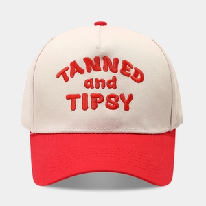 Detail of 3D letter embroidery and stitch lines on a two-tone cotton baseball cap