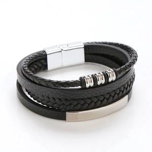 Detailed view of multilayer black braided leather bracelet with silver magnetic metal clasp