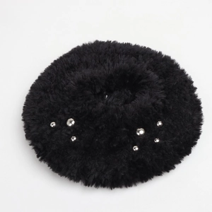 Close-up of black faux fur beret with silver bead embellishments and soft texture