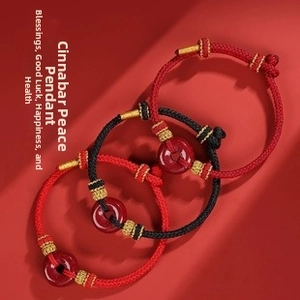Three handmade woven bracelets with red cinnabar Ping'an buckle and gold metal accents