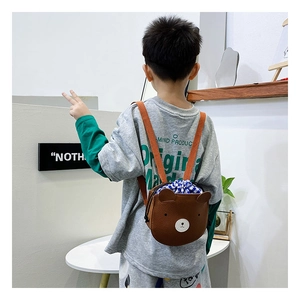 Detail of cute bear backpack showing lychee grain PU leather and drawstring closure