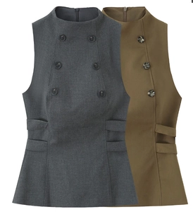 Detailed view of grey and khaki sleeveless double-breasted tops with high necklines