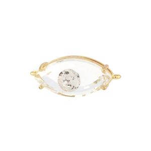 Macro shot of gold-plated evil eye charm with translucent crystal and marquise facets