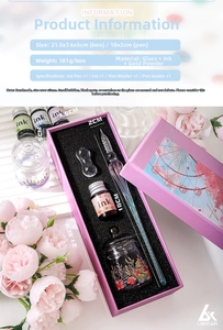 Detail of gradient glass dip pen set with ink, holder, and container in a pink gift box