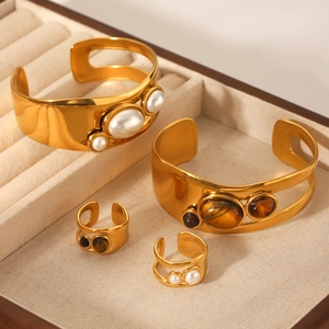 Gold stainless steel hollow bangle and ring set with pearls and tiger eye stone