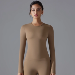 Long-sleeved compression yoga shirt in earthy tan featuring moisture-wicking fabric