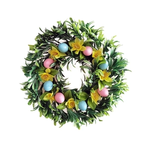 Easter wreath with green leaves, yellow flowers, and colorful eggs on white background