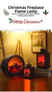 Cozy Christmas lanterns with LED dancing flame effect on a wooden table with books