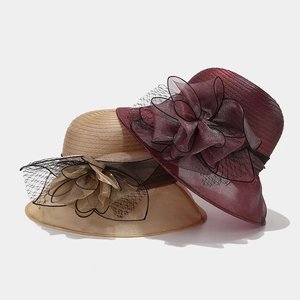 Elegant organza sun hat with large floral detail for beach vacations and summer weddings