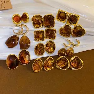 Retro amber resin earrings in geometric irregular shapes with gold metal frames