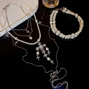 Elegant multi-layer pearl necklace and bracelet set with diamond cross pendants