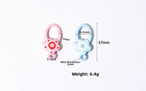 Detail showing pink and blue flower-shaped spring buckles with dimensions and metal texture