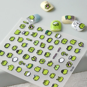 Vue macro d'autocollants 5D pour ongles avec motifs de grenouilles de dessin animé