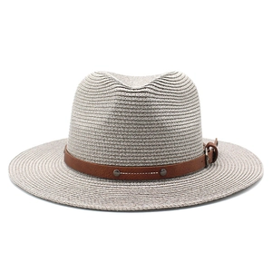 Detail of grey woven fedora hat with a brown leather band and silver metal rivets
