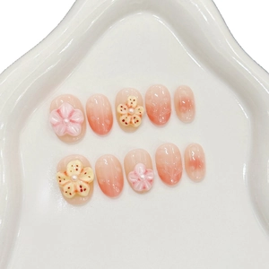 Pink gradient press-on nails with 3D embossed frangipani flowers and pearl accents
