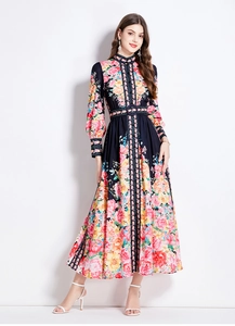Detail of floral printed long sleeve dress featuring stand collar and waist belt decoration