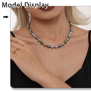 Chic multi-color 8mm pearl necklace worn by model showing deep teal and bronze tones