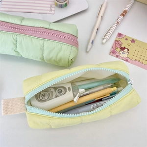Quilted down fabric pencil case with wide zippers and candy-colored pastel finish