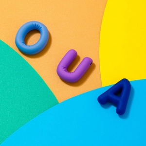 Detail view of 3D letters O U A with a matte texture in blue and purple tones