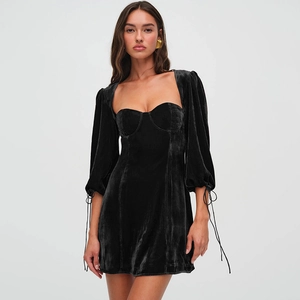 Elegant black velvet mini dress featuring puffy long sleeves and lace-up cuff details