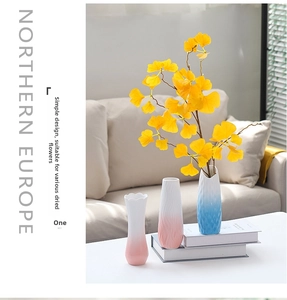 Detail of modern ripple texture ceramic vases in blue and pink gradient finishes