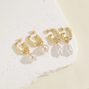Elegant gold U-shaped pearl hoop earrings featuring round and teardrop pearl drops