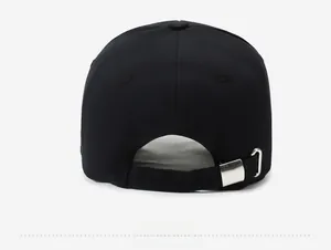 Detailed rear view of black cotton baseball cap with adjustable silver metal buckle strap