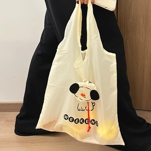 Foldable cream shopping bag with a cute 3D cartoon dog pocket and Weekend print