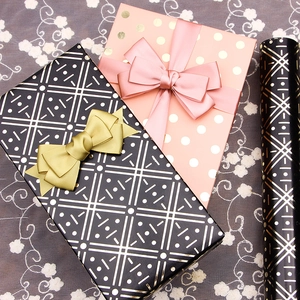 Pink gold polka dot and black geometric wrapping paper with silk ribbon bows