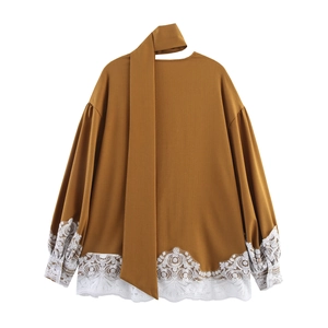 Elegant caramel brown long sleeve top with lace trim and scarf neck tie-up detail