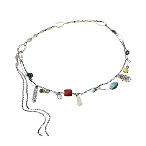 Bohemian silver waist chain with colorful beads and metal leaf charms on white background