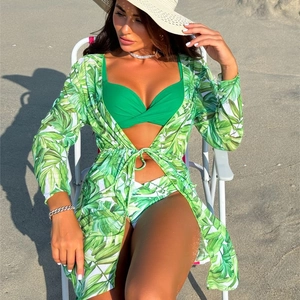 Three-piece bikini set with green tropical palm leaf print and long sleeve cover-up