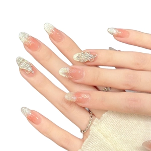 Pink gradient almond press-on nails with silver glitter, snowflake motifs and 3D rhinestones